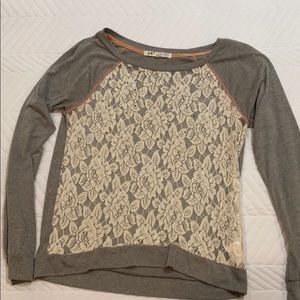 Adorable lace overlay top w/ sequins.